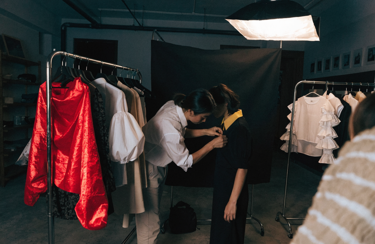 Behind the scenes of a fashion photo shoot backstage